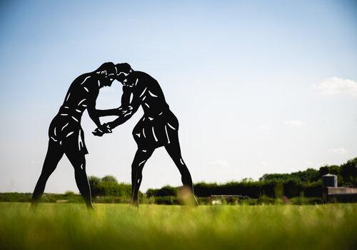 Lutteurs de la palestre Silouhette de deux lutteurs dans la palestre de Gisacum
