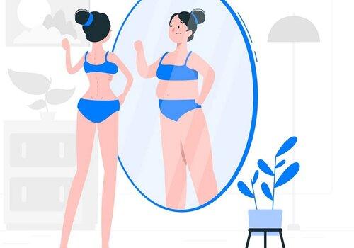 Image d'une jeune fille se regardant dans un miroir et se voyant plus ronde que ce qu'elle n'est