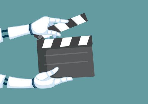 Mains robots tenant un clap cinéma